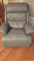 Front view of light green leather La-Z-Boy recliner showing overall design and condition