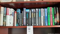 Full shelf view showing all twenty mystery novels by Rankin, James, Rendell