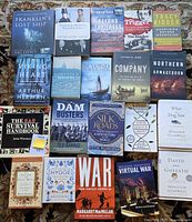 All books laid out in four rows showing titles and formats