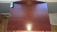 Top view of night table showing cherry finish and minor scratches