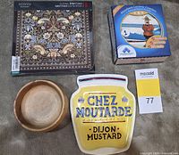 All four items grouped: sealed trivets, boxed coasters, spoon rest, wooden bowl