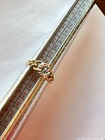 Ring on mandrel showing size 6.5 and chain-link design