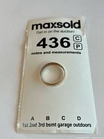 Overall view of gold band on MaxSold lot card
