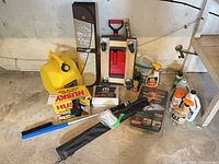 All items grouped together showing variety including fuel cans, dolly, solar panel kit, shovel, sunshade, cleaners