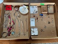 Overview of both trays showing majority of necklaces, bracelets, earrings and rings