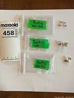 Overview: three pairs earrings with labelled bags showing 10K and 14K stamped backings