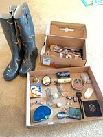 Overall lot: rain boots, boxed sandals, tray of trinkets