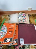 Overview of binders, catalogues and open stamp album