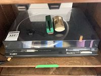 Turntable with dust cover and cartridge holders visible