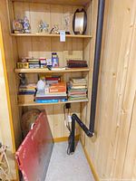 Full shelving unit with puzzle board, games, books and collectibles