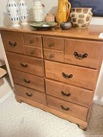 Front view of eight-drawer dresser showing drawer arrangement and hardware