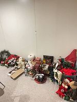 Overview of tote and spread of Christmas decorations against wall
