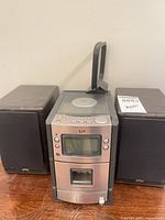 Front view of JVC stereo main unit with two speakers