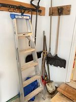 Overall view showing ladder and yard tools