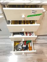 Four open drawers showing overall contents