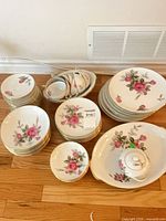 All pieces grouped on floor showing dinnerware set