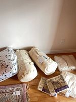 Overall lot showing duvets, comforter, bedspreads, bedding sets