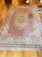 full view of rug showing design and fringe