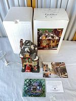 Full lot view: illuminated building, cord, box, styrofoam, paperwork