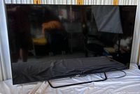 Front view of Sony 55" TV on stand