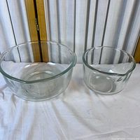 large and small thick glass bowls side by side