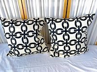 Both cushions front view showing pattern and condition