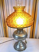 Full view of converted oil lamp illuminated