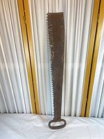 Full view of crosscut saw showing overall size and loop handle