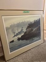 Full view of framed print leaning against wall