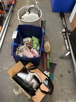 Group view showing vacuum in box, buckets, bin, cloths, brushes and tools