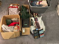 Overview of boxes and tote containing Christmas items