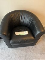 Front view of black leather club chair
