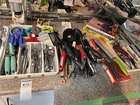 Wide view of lot showing cutlery tray, utensils pile, Misto sprayer box, cookbooks