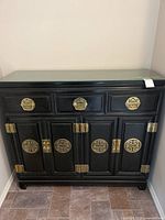 Front view showing dresser, drawers, doors, brass pulls and hinges