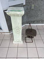 Pedestal column next to pagoda lantern