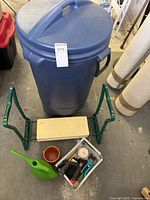 Overall lot showing garbage can, kneeler, tools