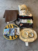 Overview of all items: tablecloth, linen stack, napkin packs, cushions, chargers, platter with cups and saucers