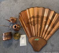 All five metal items together on carpet