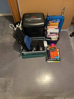 Complete lot overview with shredder, keyboards, speakers, cords, books, file organizer and floor mat