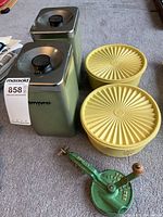 Group shot of both canisters, two Tupperware bowls, and bean slicer