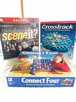 Front view of all three game boxes