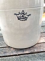 Front of crock showing crown 4 emblem and exterior glaze