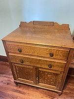 Front view showing drawers, cupboard doors and backsplash