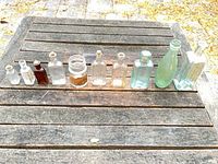 All ten assorted glass containers displayed on table