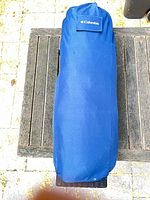 Blue Columbia carrying case on wooden surface