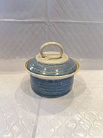 Side view of cream and blue covered bowl