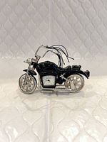 Front view showing clock dial and overall motorcycle design