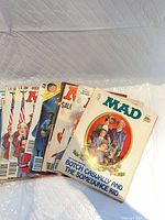 Stack of MAD magazines showing various covers