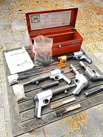 Entire lot including four stud drivers, toolbox, manual, accessories