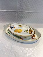 Two nested Evesham dishes showing size difference and patterns